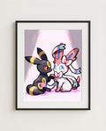 Umbreon & Sylveon kawaii art print framed on a wall — Pokémon fan art by Dammit.png